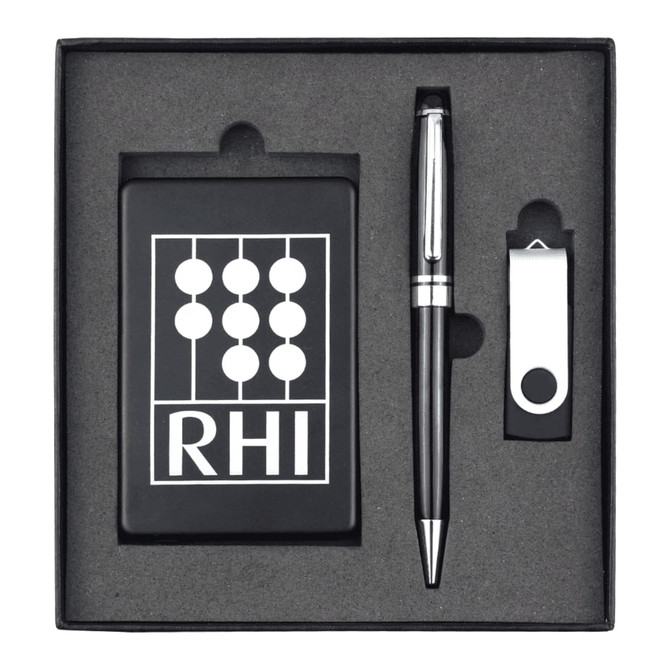 A black gift set containing a pen, a USB drive, and a card holder, all neatly arranged in a black box with a logo.