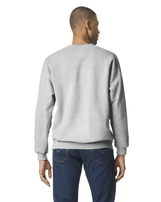A grey Gildan Softstyle adult sweatshirt viewed from the back, worn with dark jeans. It features a logo.