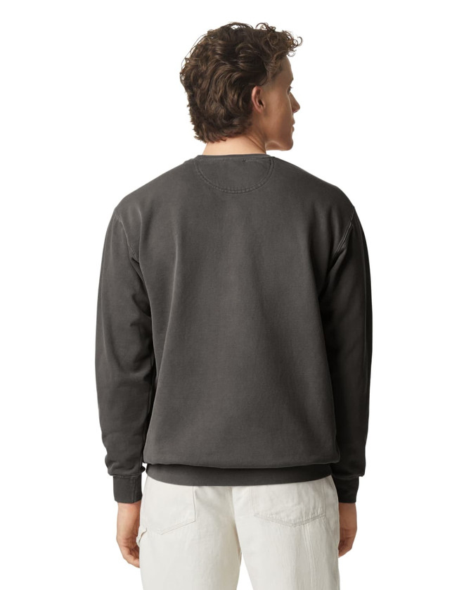 A back view of a grey adult crewneck sweatshirt featuring a logo on the neck. The model is wearing light-coloured pants.