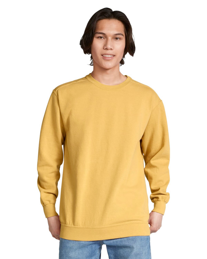 A yellow adult crewneck sweatshirt with long sleeves, featuring a simple design and logo.