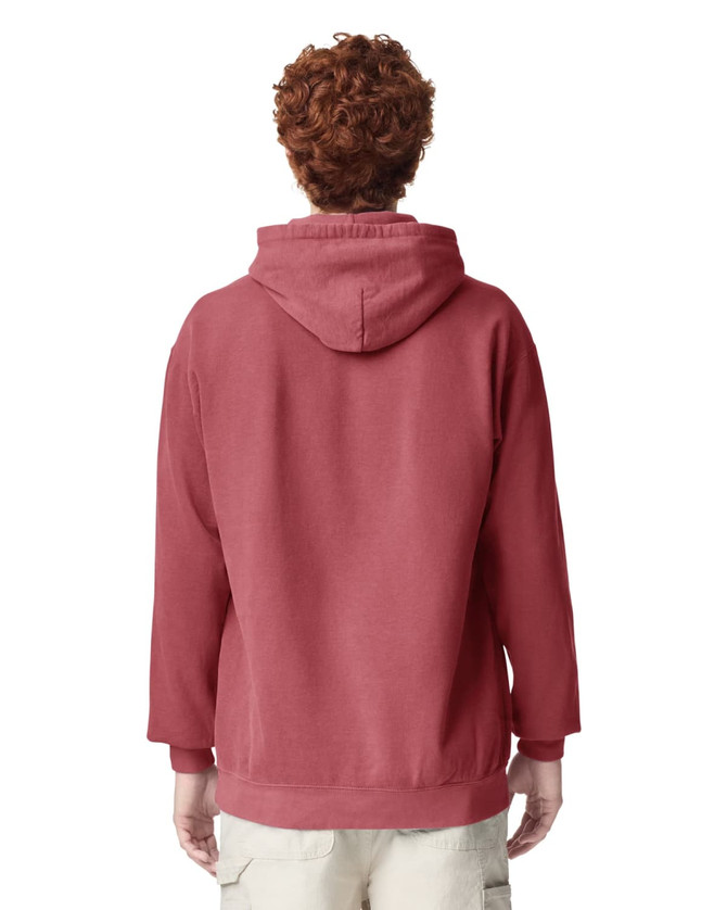 A hooded sweatshirt in a deep red colour, featuring a back view of a person wearing it. The design includes a logo.
