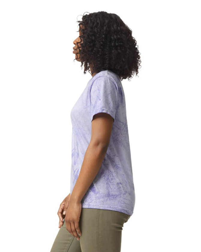 A lavender heavyweight t-shirt is displayed on a model, featuring a relaxed fit and short sleeves. The shirt has a logo.