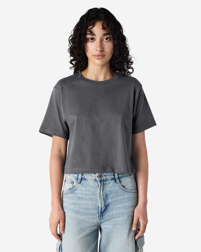 A grey women's boxy t-shirt with short sleeves, featuring a round neckline and a logo on the side.