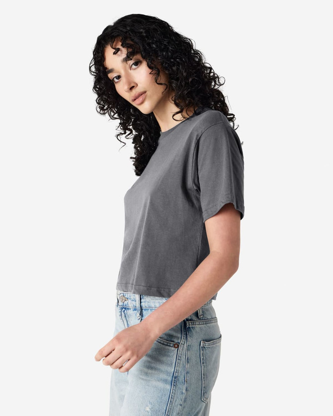 A grey women's boxy T-shirt with a relaxed fit, featuring short sleeves and a simple design.