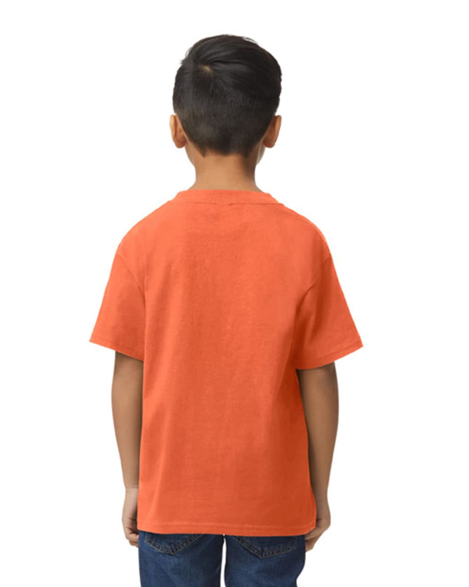 A youth midweight T-shirt in orange, featuring a logo, displayed on a boy standing sideways.
