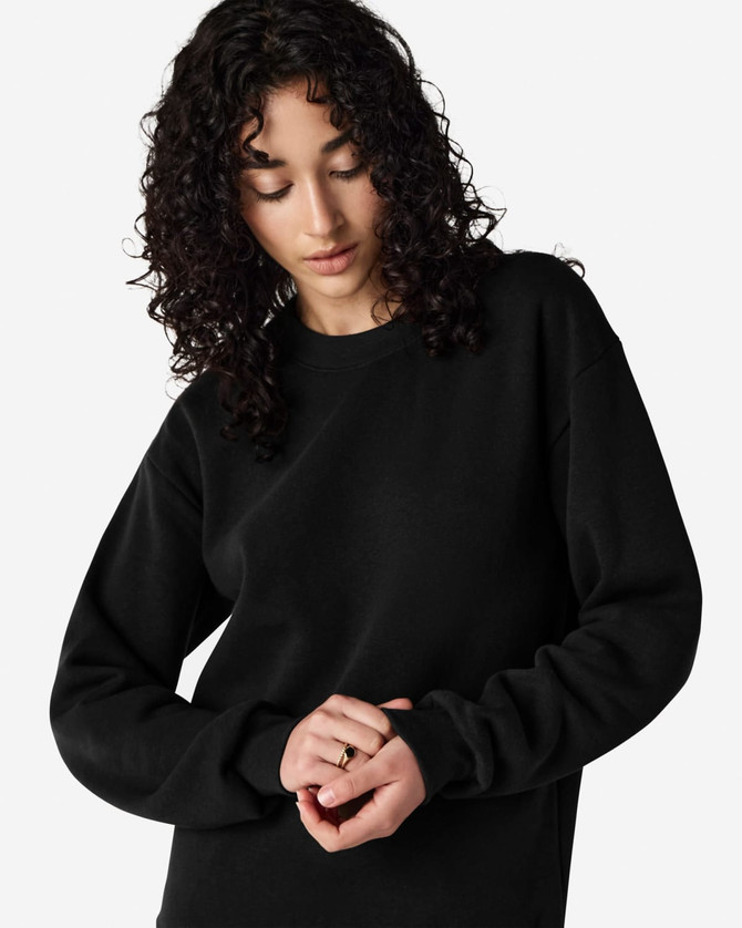 A black unisex crewneck sweatshirt with long sleeves, featuring a logo on the front.