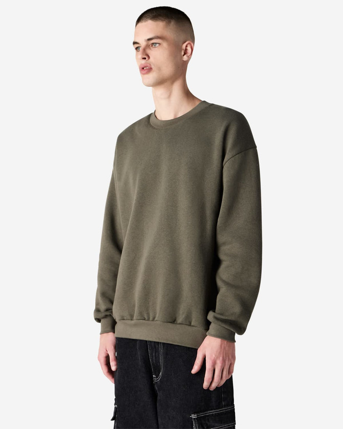 A unisex crewneck sweatshirt in green, featuring long sleeves and a relaxed fit, with a logo at the hem.