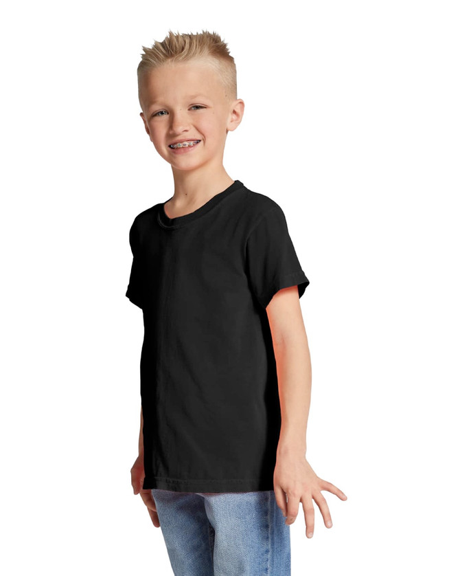 A youth short sleeve T-shirt in black, displayed by a smiling boy wearing casual jeans. The shirt features a logo.