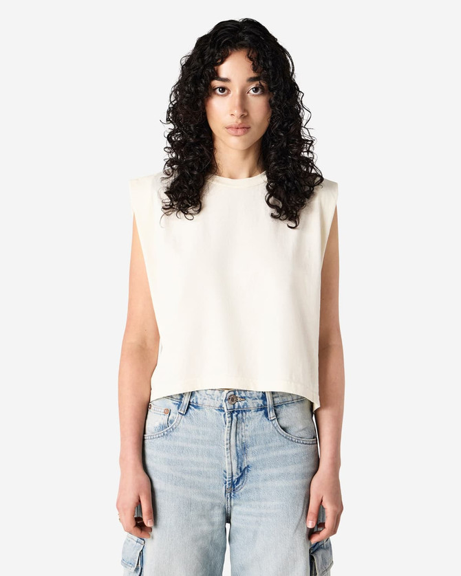 A cream-coloured women's muscle T-shirt with a relaxed, sleeveless design, featuring a logo.
