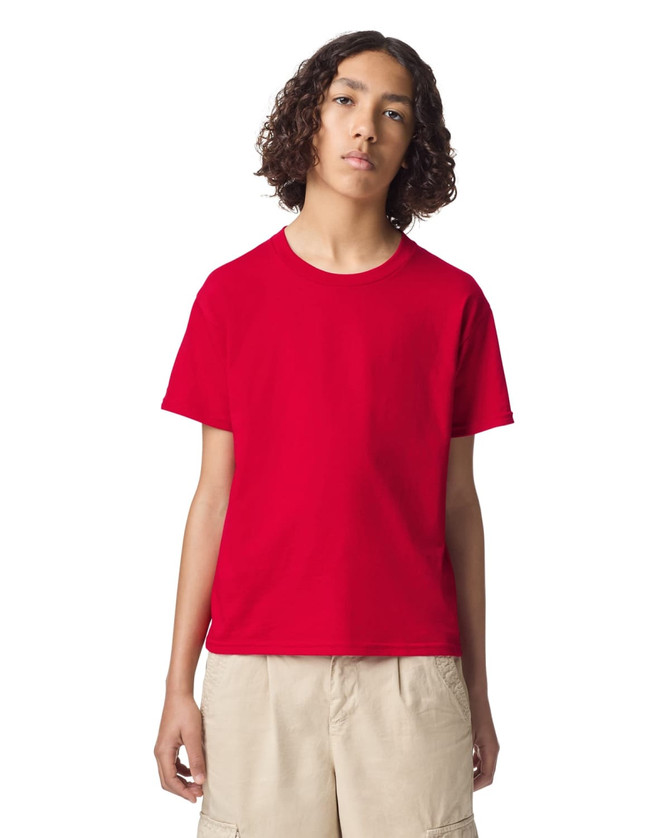 A bright red youth t-shirt with a round neckline and short sleeves, featuring a logo on the front.