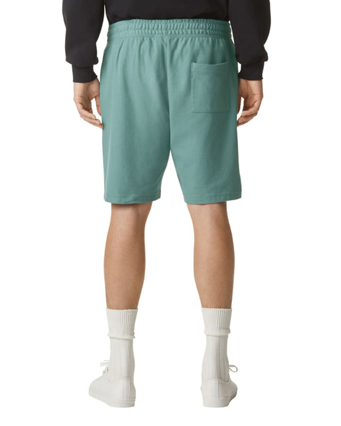 Teal unisex gym shorts with an elastic waistband and a single back pocket. Features branding on the garment.