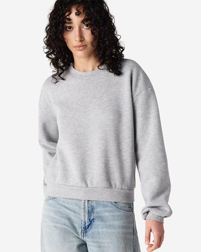 A grey women's crewneck sweatshirt with a relaxed fit and long sleeves. It features a logo on the front.