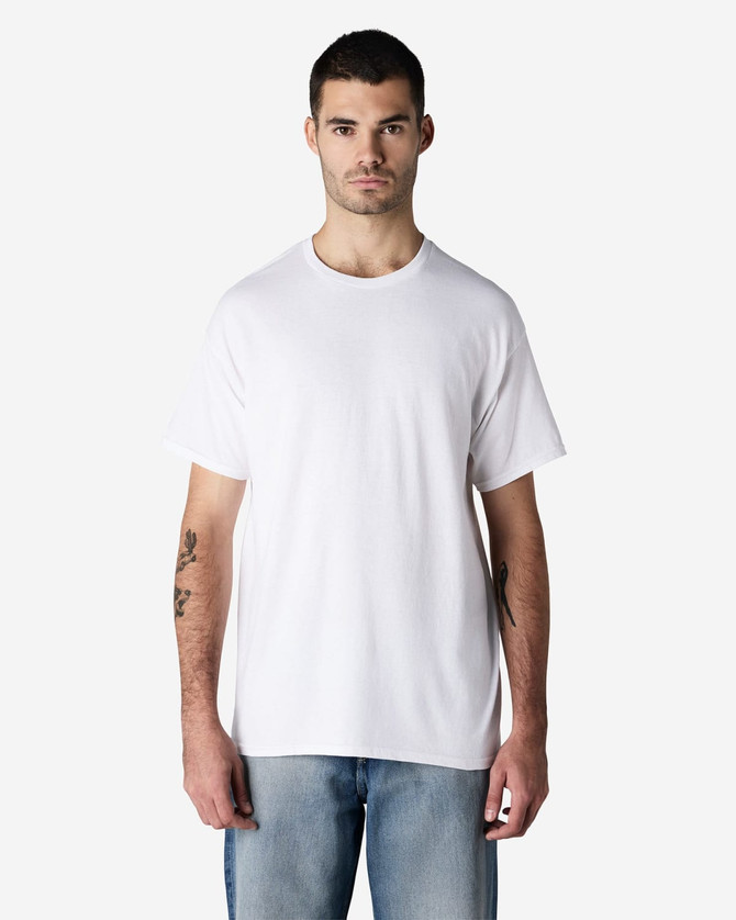 A white Gildan Light Cotton T-Shirt displayed on a male model, featuring a simple design and relaxed fit.