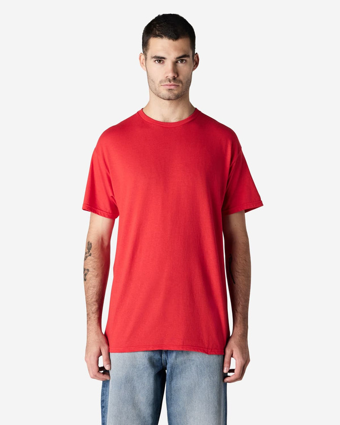 A red Gildan Light Cotton T-Shirt displayed on a model, with a plain design and short sleeves.