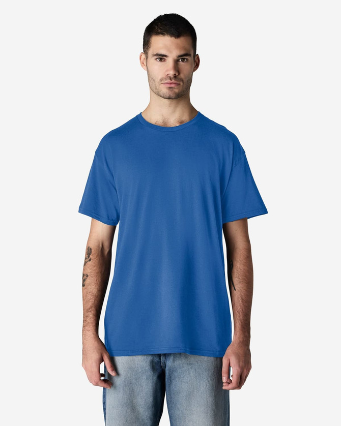 A blue Gildan Light Cotton T-Shirt displayed on a model, featuring a simple design and short sleeves.
