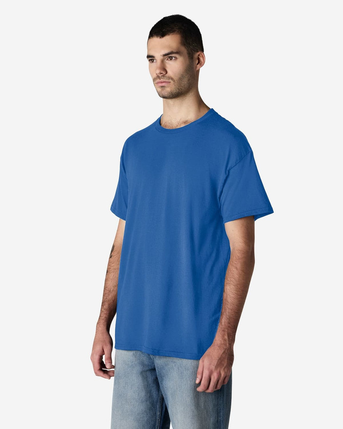 A blue Gildan Light Cotton T-Shirt displayed on a male model, featuring a simple design and loose fit.