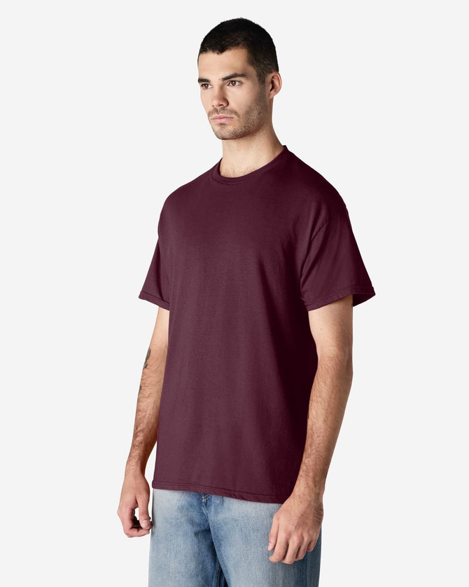 A maroon Gildan Light Cotton T-Shirt displayed on a male model, featuring a simple design and short sleeves.