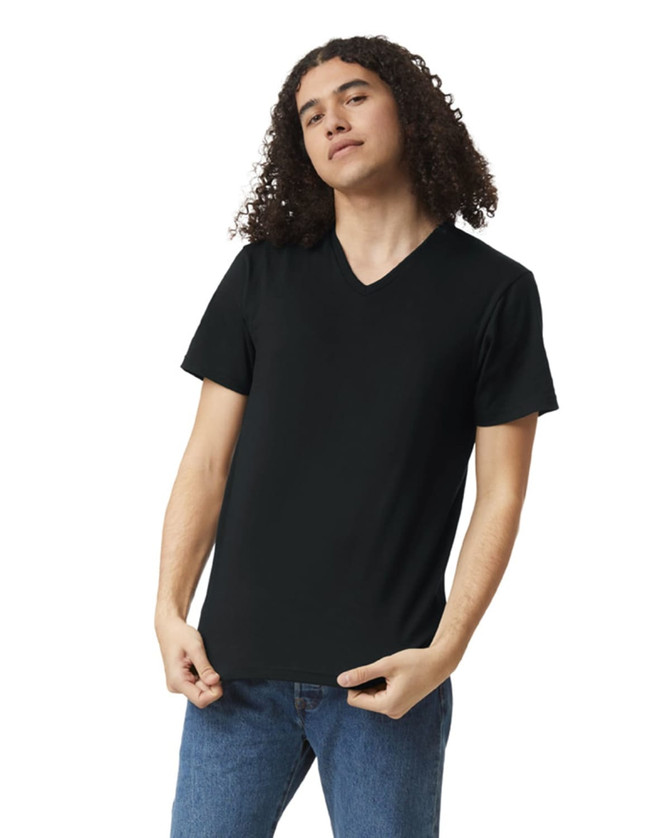 A black unisex V-neck T-shirt displayed on a model, featuring short sleeves and a fitted style.