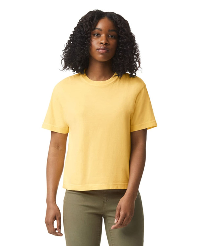 A boxy women's t-shirt in a vibrant yellow colour, featuring short sleeves and a relaxed fit.