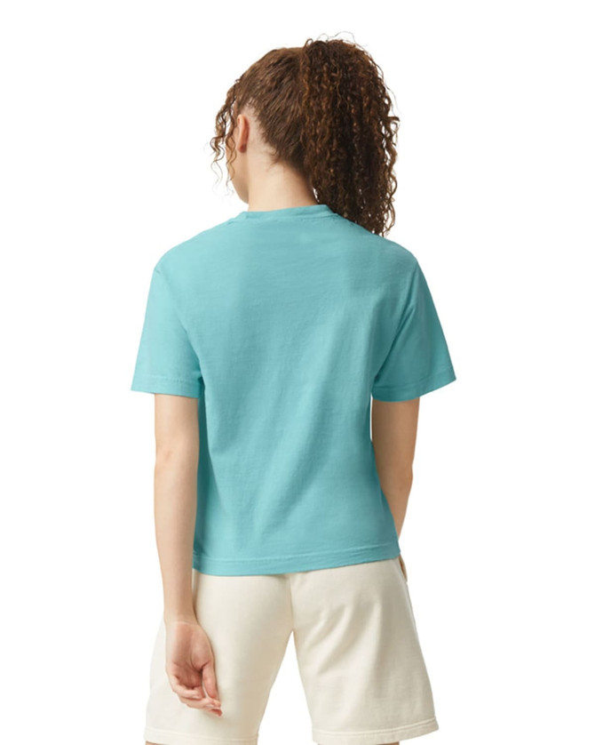 A turquoise women's heavyweight boxy T-shirt, featuring a relaxed fit and short sleeves, with a logo on the back.