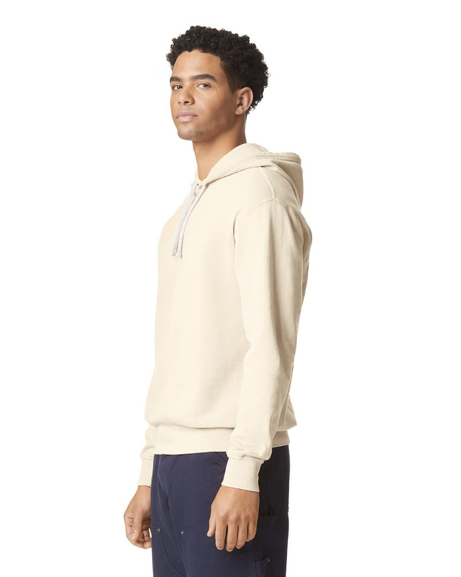 A lightweight hooded sweatshirt in beige, featuring a drawstring hood and a subtle logo.