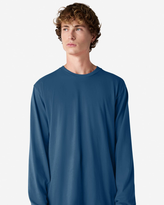 A long sleeve t-shirt in deep blue, featuring a simple design and a logo on the front.