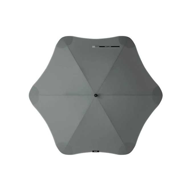 A grey BLUNT Classic Umbrella with a unique star-like shape and a central button. It features a logo.
