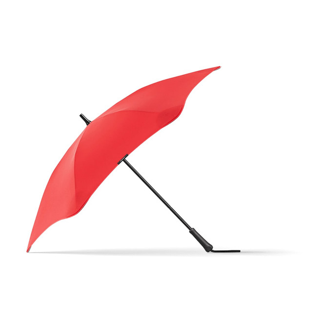A red BLUNT Classic Umbrella with a black handle, showcasing its unique curved design. It features a logo on the canopy.
