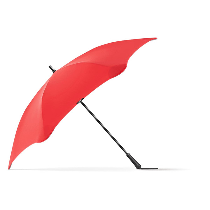 A red BLUNT Exec Umbrella with a black handle and frame, featuring a sleek design and a brand logo.