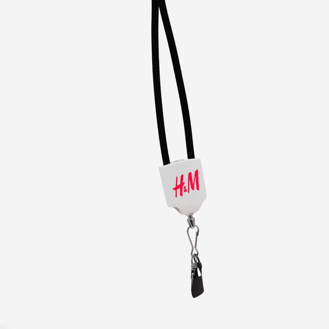 A black lanyard features a white attachment with a branding logo and a clip at the end.
