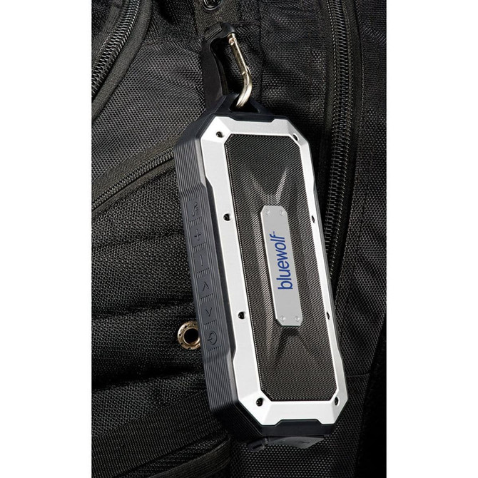 A rugged black and silver Bluetooth speaker with a carabiner attached, featuring a branding logo on the side.
