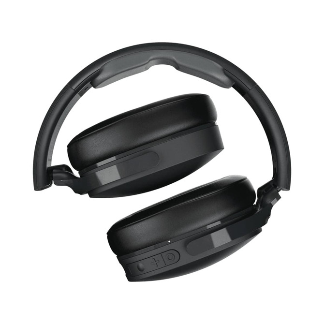 A pair of black wireless headphones with a sleek design and adjustable headband, featuring a logo on the side.