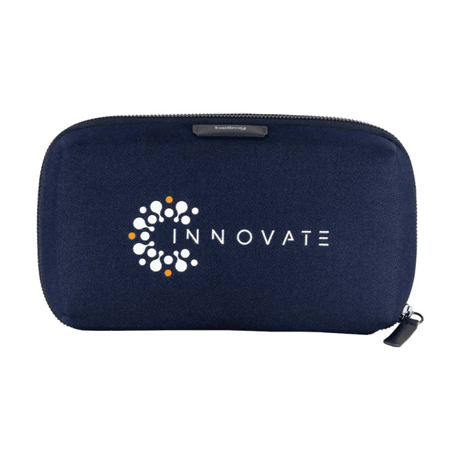 A navy blue tech kit bag featuring a logo and a zip closure, designed for carrying various tech accessories.