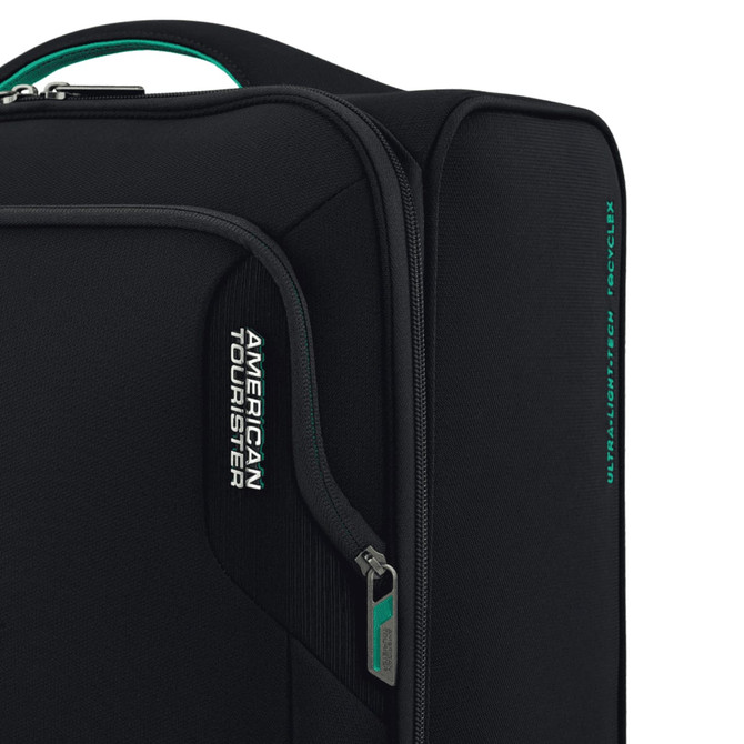 A black travel underseater bag with a zipper and a branding logo. Features a teal accent on the handle.