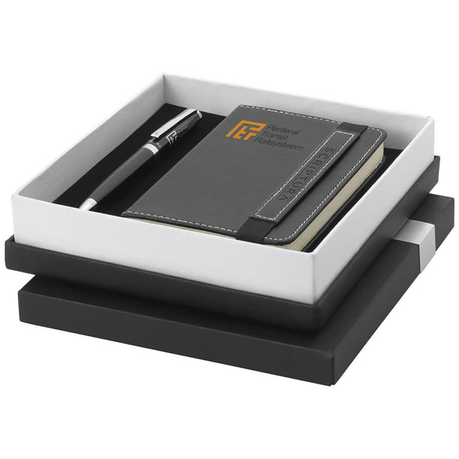 A black gift set featuring a notebook and a pen, presented in a sleek box with a logo.