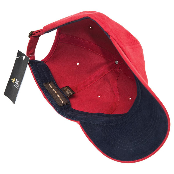 A red and navy cap with a branded tag, featuring an interior view showcasing its brushed cotton design.