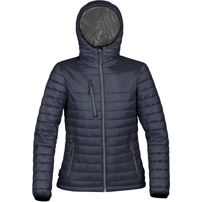 A women's puffer jacket in navy blue with a hood and zippered pockets, featuring a logo.
