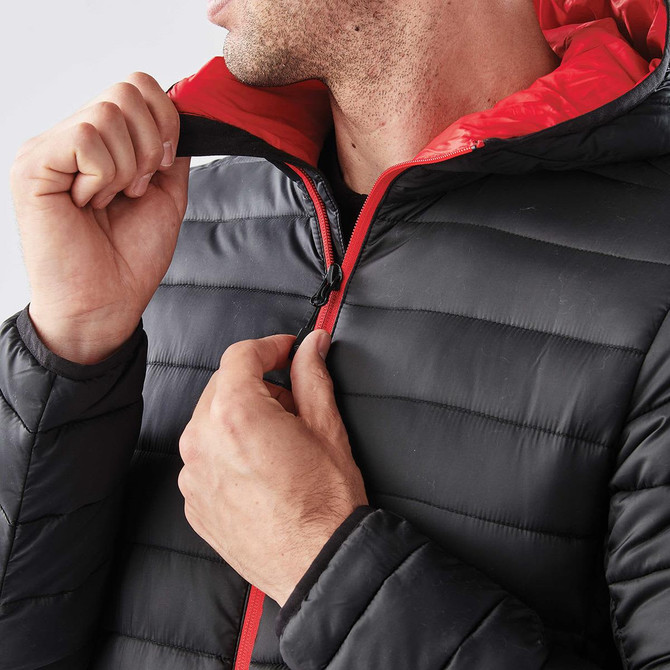 A Men's Stavanger Thermal Jacket in black with a red interior, featuring a zip and hood. It has a logo on the sleeve.