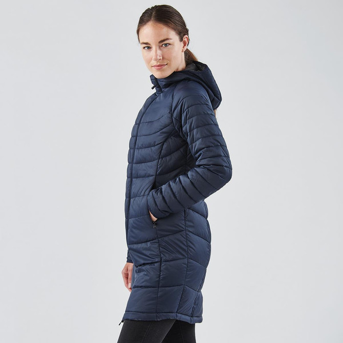 A navy women's parka jacket with a hood, featuring a quilted design and side pockets. It has a logo on it.