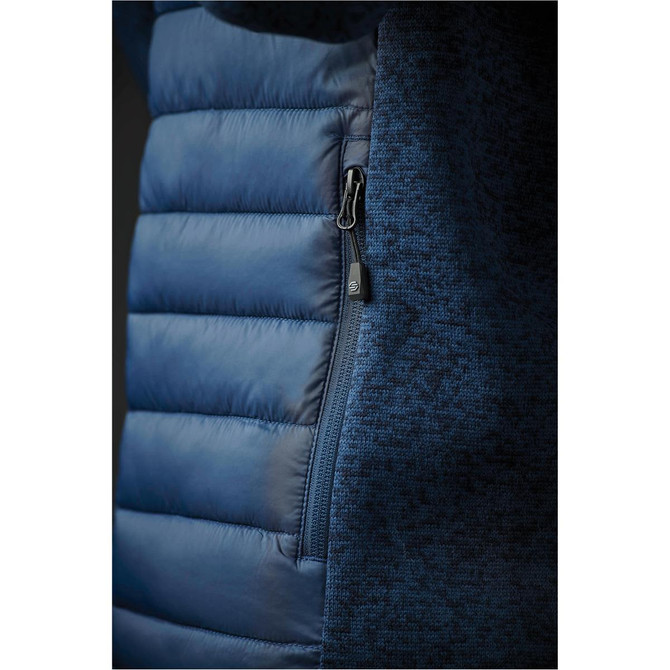 A navy hybrid jacket featuring a padded front and textured fabric, with a zipper detail on the side.