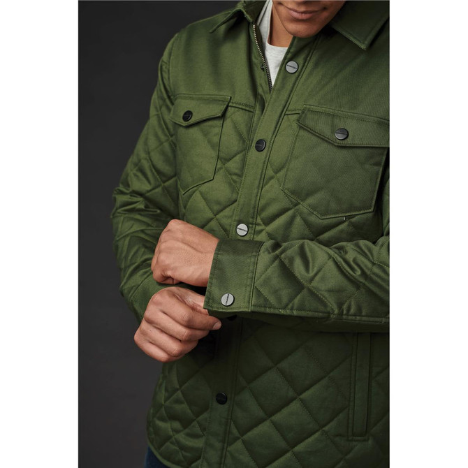 A green quilted jacket with a button-up front and chest pockets, featuring a logo on the upper left.