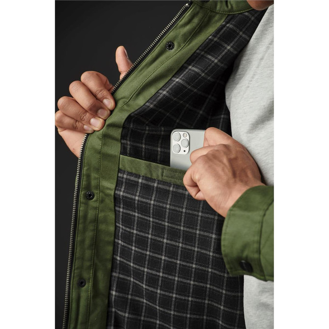 A quilted jacket featuring an olive green exterior and a checkered interior, with someone placing a phone in the inner pocket.
