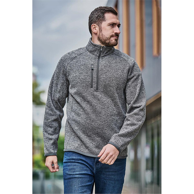 A men's grey 1/4 zip pullover with a high collar and a zip pocket on the chest, featuring a logo.