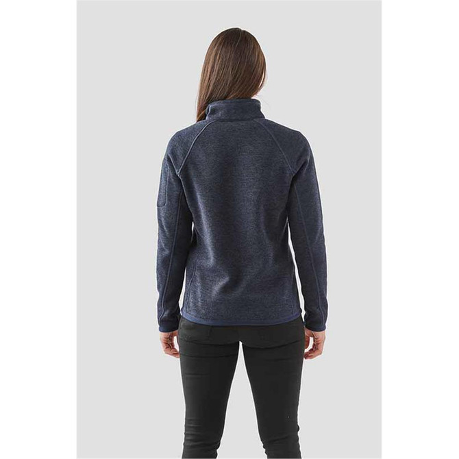 A navy women's 1/4 zip pullover with a high collar and a fitted design, featuring a logo on the sleeve.