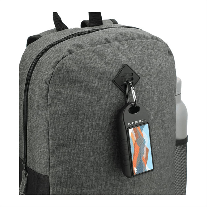 A grey backpack with a water bottle holder and a decorative tag attached.