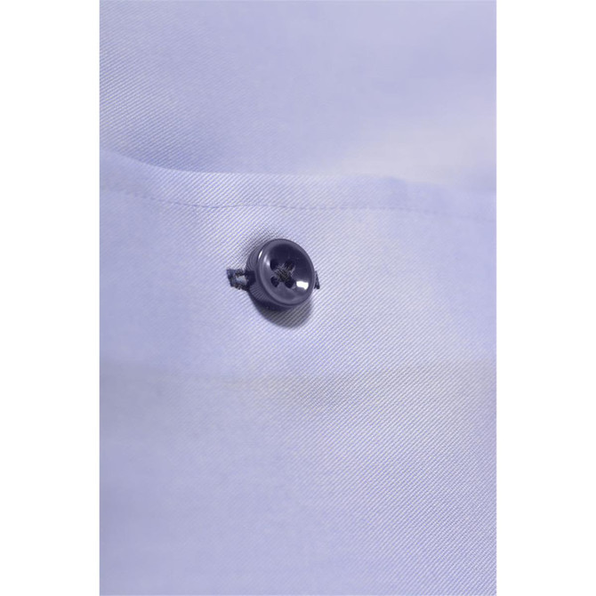 A close-up of a light blue button-up shirt featuring a silver button. The fabric is smooth and neatly folded.
