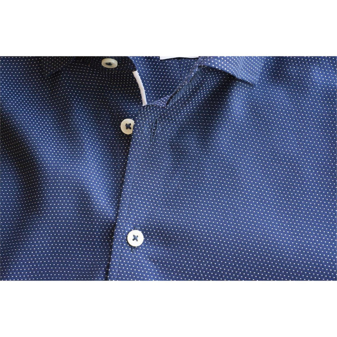 A purple button-up men's shirt featuring a dotted pattern and white buttons, with a logo on the collar.
