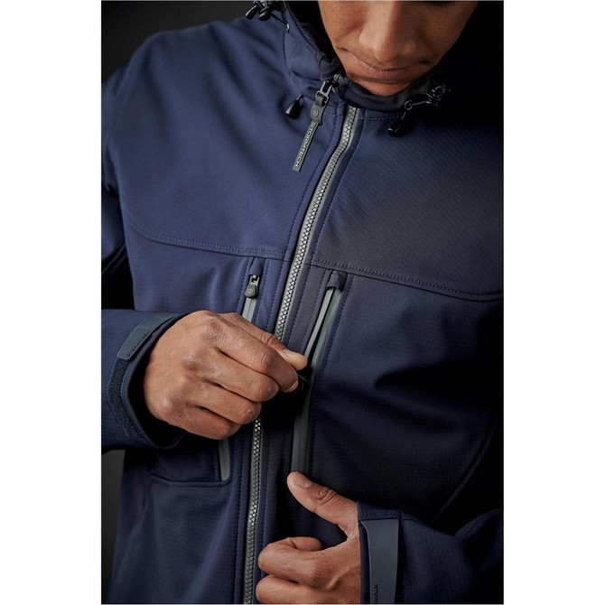 A navy blue men's jacket with a hood, featuring multiple zippered pockets and a sleek design.