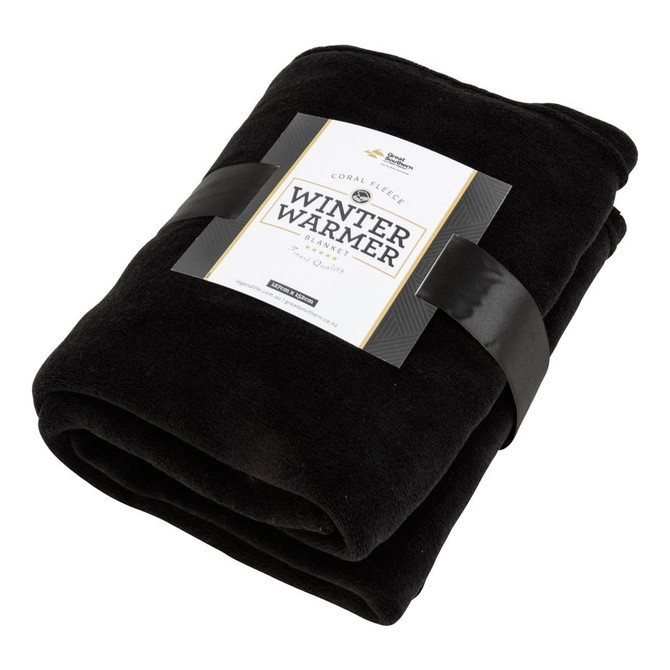 A black Coral Fleece blanket wrapped with a band featuring branding, showcasing its soft texture and warmth.