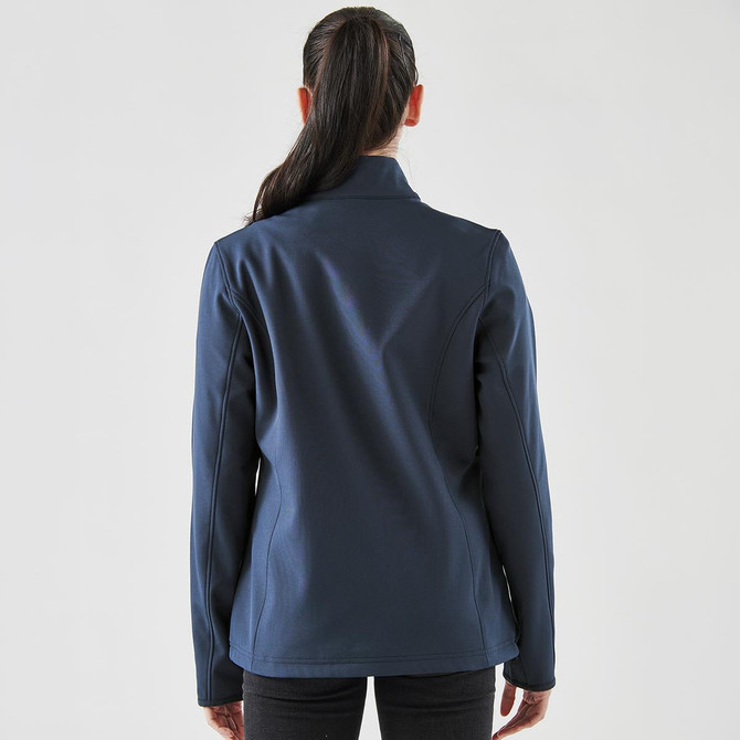 A navy blue softshell jacket is displayed, featuring a simple design and a logo on the back.